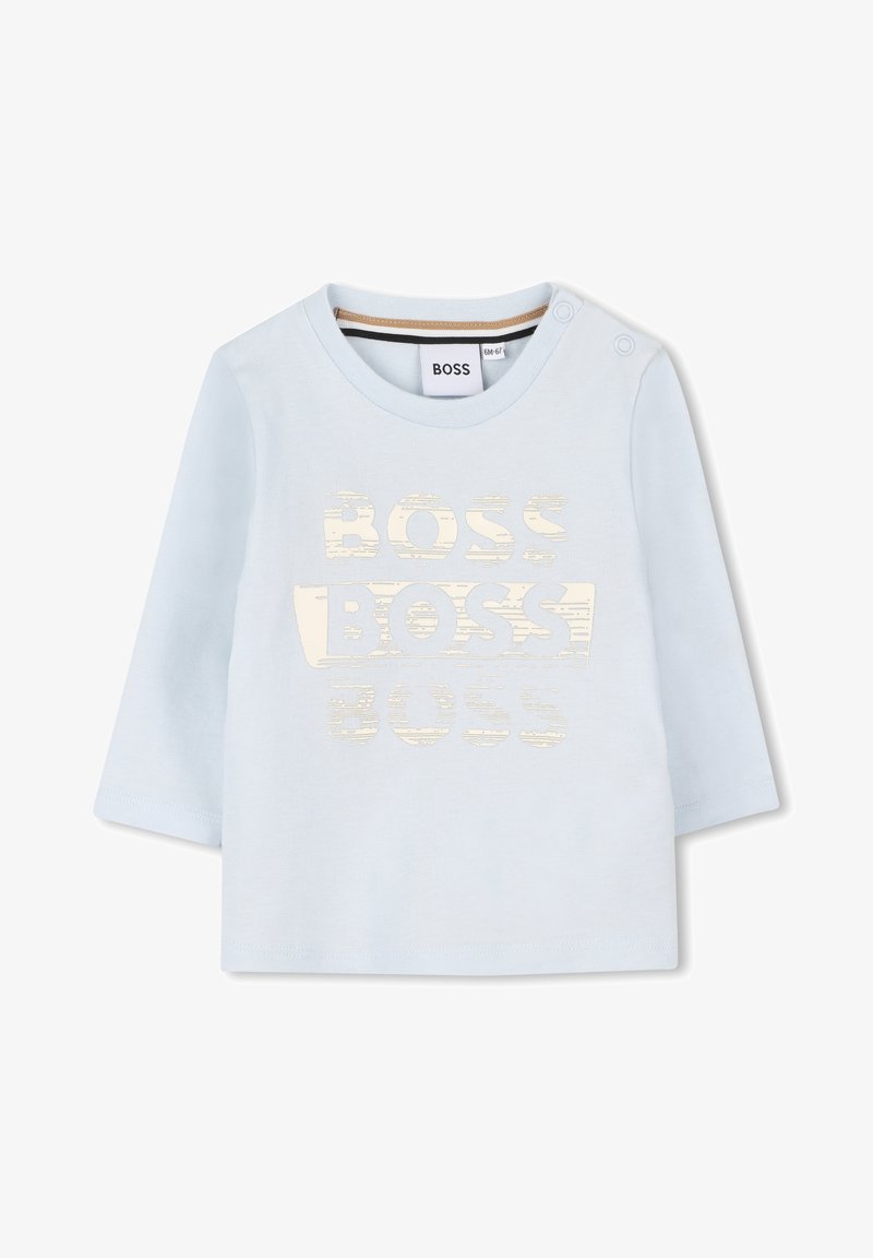 Világoskék, hosszú ujjú pamut póló, amelyen egy textúrázott elefántcsont színű "BOSS" logó található az elején. Vállpántokkal rendelkezik.