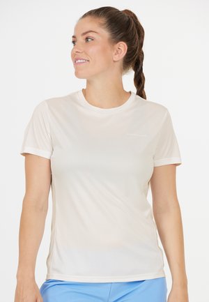 Ljust beige idrottströja gjord av fuktavvisande material. Har korta ärmar, rund hals och subtil märkeslogotyp på framsidan.