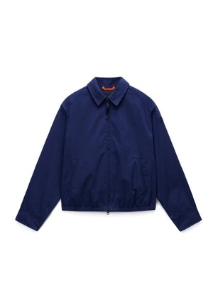 Veste zippée bleu marine avec col, manches longues, deux poches latérales et ceinture élastique, présentée à plat sur fond blanc.