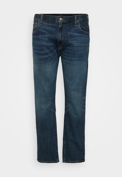 Calças de ganga azul escuro com corte reto, com cinco bolsos, costuras visíveis e fecho de botão. Lavagem ligeiramente desbotada nas coxas.