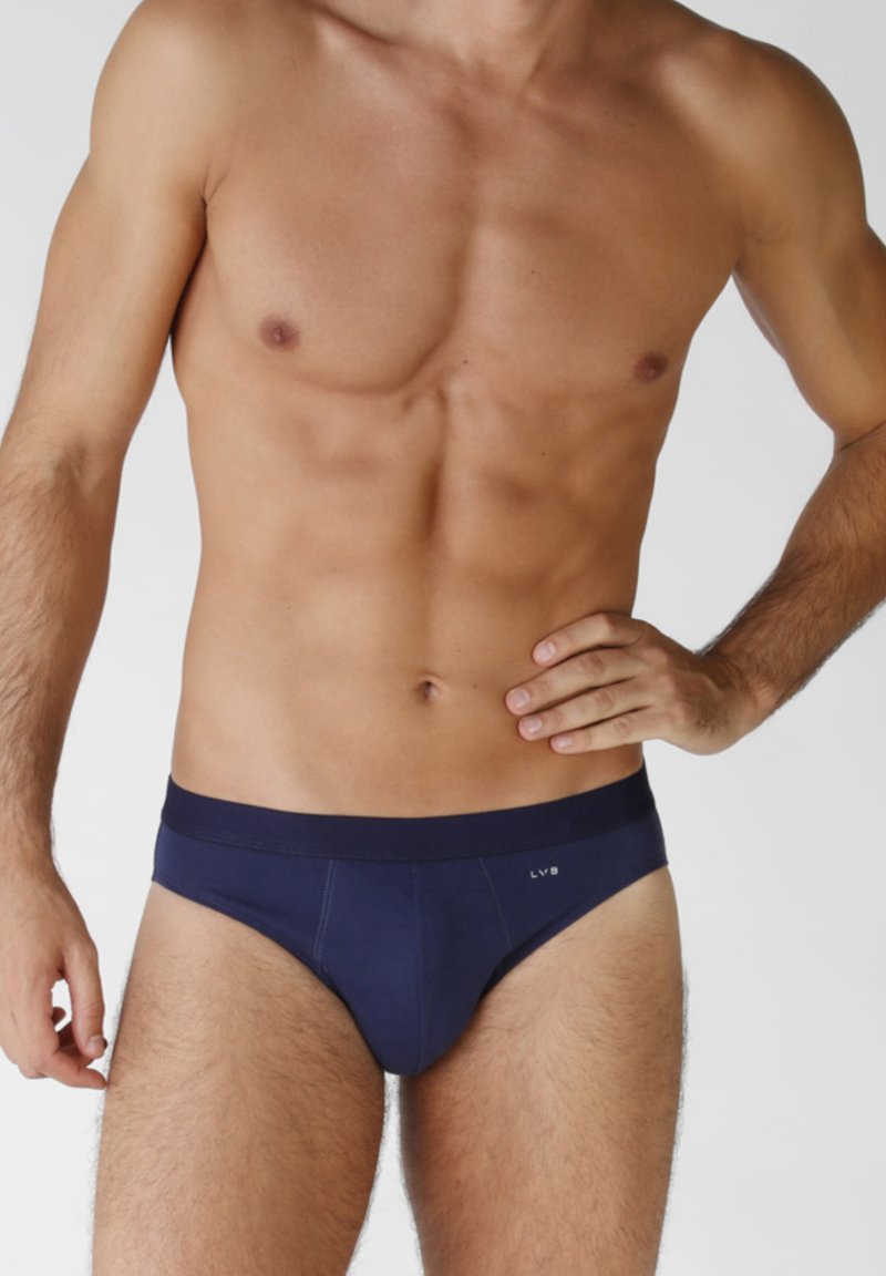 Borsa color blu navy realizzata in tessuto morbido, con una fascia in vita comoda e dettagli di cuciture minime. Design classico senza motivi visibili.