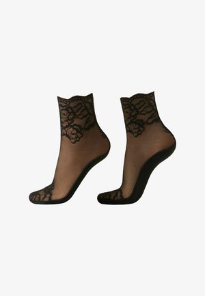 Chaussettes noires transparentes jusqu'à la cheville avec bordure en dentelle florale aux poignets, aux orteils et aux talons.