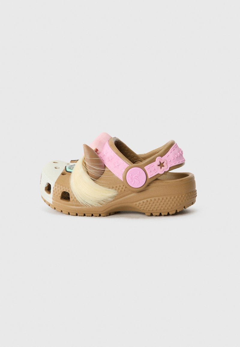 Light brown clog with a white front, pink strap featuring star patterns, and decorative brown horn and faux fur accents.