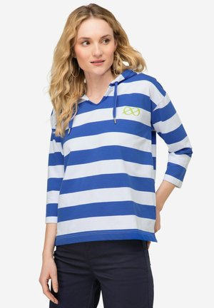 Felpa a righe blu e bianche con scollatura a V, maniche a tre quarti e un accento verde del logo. Realizzata in tessuto morbido e leggero.