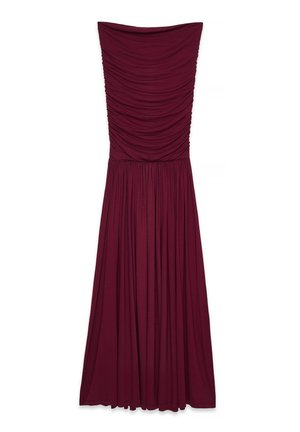Bordeaux strapless jurk met een geraffineerde corsage, vloeiende rok en zachte stofstructuur. Lengte tot de grond met een elastische tailleband.