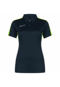 Marineblaues Poloshirt mit limonengrünen Akzenten, aus glattem Stoff. Verfügt über einen Kragen, drei Knöpfe und ein weißes Nike-Logo auf der Brust.