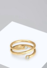 Goldener Doppelring mit zwei runden, klaren Steinen an jedem Ende, geschwungene, glatte Form, polierte Oberfläche und graviert mit "925."