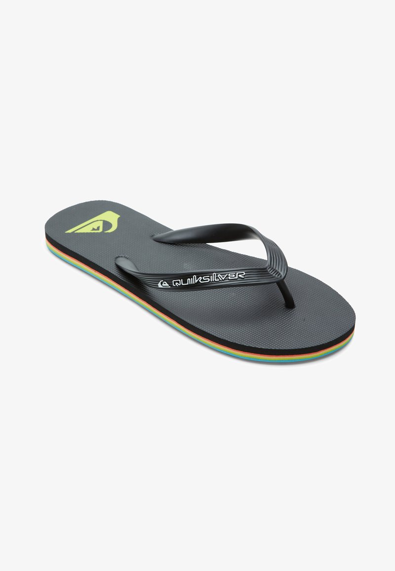 Claquettes noires avec semelle texturée, dotées d'une bride noire et d'une semelle intermédiaire colorée et superposée. Logo Quiksilver imprimé sur le semelle.