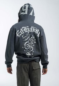 Gray hooded sweatshirt featuring large white dragon and rose graphic on the back, with "Ed Hardy" and "97" printed above.