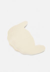 Collection of beige adhesive pads, shaped with rounded edges, stacked in a fan-like arrangement with a smooth texture and subtle sheen.