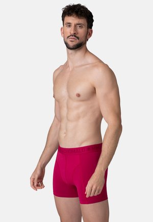 Røde boxer-shorts i blødt, strækbart stof. Med en sort logobånd i taljen og ergonomisk design for komfort.