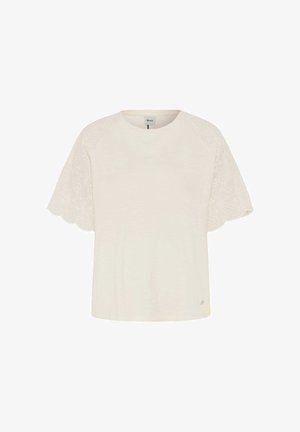 Top crema a maniche corte con scollo rotondo e ricamo in pizzo smerlato sulle maniche, disposto in piano su sfondo bianco.