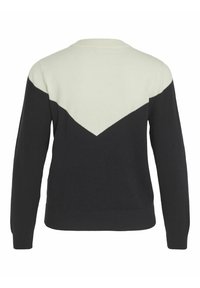 Pull noir à manches longues avec un motif chevron blanc traversant le haut du dos et les épaules.