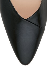Black leather high-heeled shoe with a pointed toe and crossed design at the vamp. Smooth texture and minimalistic style.