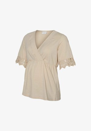 Beige korte mouwen zwangerschaps-top met V-hals, geplooide taille en kanten afwerking aan de mouwranden.