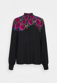 Blouse noire à manches longues avec un col haut. Possède un motif floral rose et bleu au niveau des épaules. Fabriquée en tissu léger.
