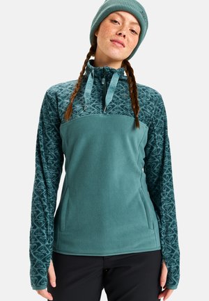 Teal fleece genser med mønstrede ermer og kvart glidelås. Har sidelommer og en matchende teal lue. Myk tekstur.