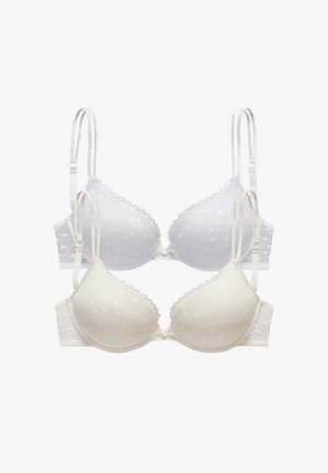 Dva grudnjaka svijetlih boja, jedan bijeli i jedan bež, s točkastim uzorkom, čipkastim detaljima i podesivim naramenicama.