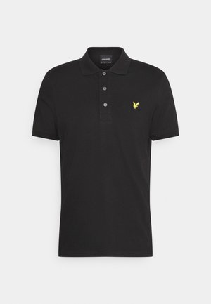 Polo negro hecho de algodón, con un cuello de tres botones, mangas cortas y un logo de pájaro bordado en amarillo en el pecho.