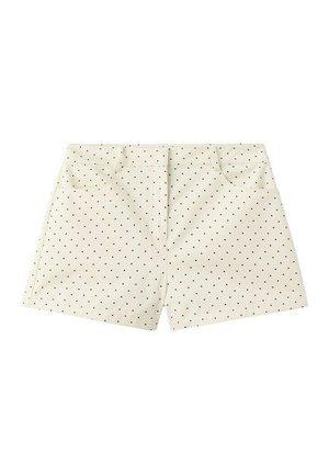 Shorts couleur crème avec petits pois noirs, poches avant et ceinture cousue.