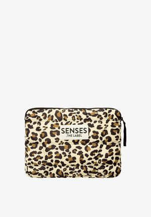 Padded laptop sleeve featuring a beige background with brown and black leopard print. Displays a logo patch labeled "SENSES .THE LABEL."