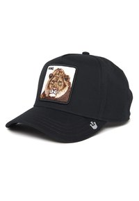 Black cap featuring a square embroidered patch of a lion's face with the text “KING” above. The brim has subtle stitching details.