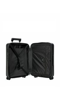 Valise rigide noire avec une fermeture éclair ouverte, dotée d'un intérieur à motif hexagonal. Comprend des compartiments en mesh et des sangles pour l'organisation.