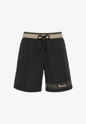 Schwarze Badehosen mit einem elastischen Bund, ausgestattet mit einem khakifarbenen Kordelzug und einem Markenband am Saum. Leichtgewichtiger, glatter Stoff.