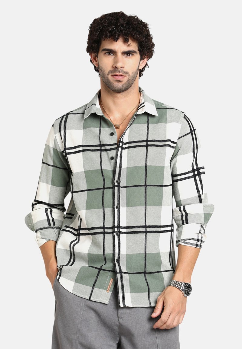 Camicia a quadri verde e bianca con accenti neri, design button-down, maniche lunghe arrotolate. Tessuto morbido, dotata di tasca e dettaglio etichetta.