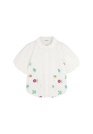 Blouse blanche à manches courtes avec des épaules bouffantes, ornée de broderies florales colorées en rouge, vert, bleu et rose. Devant à boutons.