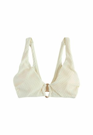 Biustonosz bralette z fakturowanej tkaniny w kolorze kości słoniowej z szerokimi ramiączkami, trójkątnymi miseczkami i metalowym zapięciem z przodu na białym tle.