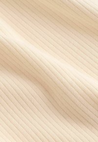 Ribbed fabric in pale cream, featuring subtle vertical lines. Soft texture with a slight sheen. Ideal for clothing or upholstery applications.