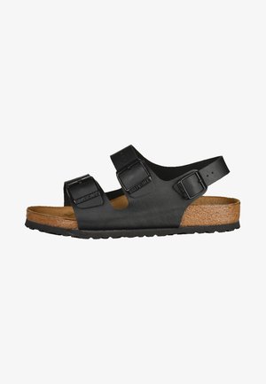 Black two-strap sandal with adjustable buckles, cork footbed, and rubber sole. Smooth finish with a simple design.