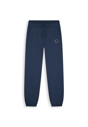 Marineblauwe joggerbroek met elastische tailleband, trekkoord, zijzakken, elastische boorden en een klein rond logo op de linker dij.