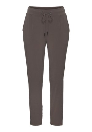 Brown jogger pants made of soft fabric with an elastic waistband, adjustable drawstring, and two side pockets. Slim fit with tapered legs.