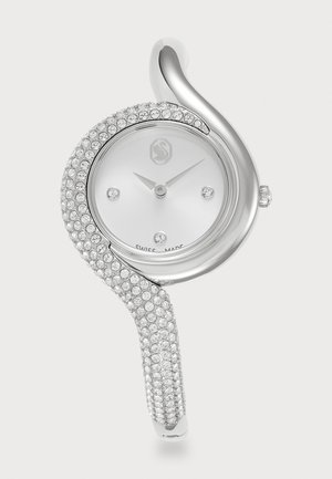 Silver wristwatch with a twisted band adorned with clear crystals. Features a round white dial, Swiss made, with three small hour markers.