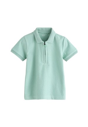 Lichtgroene polo met korte mouwen, met een textuur van een geometrisch patroon en een rits aan de voorkant onder de kraag.