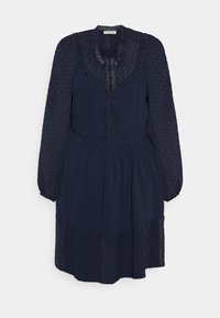 Vestido azul-marinho com mangas longas, gola ruflada, frente de botões, saia em camadas e pontos texturizados em todo o tecido. Material semi-translúcido.