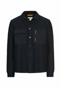Navy blue shirt made of quilted fabric. Features a fold-down collar, two front chest pockets, and a zippered side pocket. Button closure.