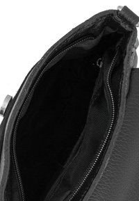 Black textured leather purse with an open zippered compartment showing the interior lining and metal clasp details.