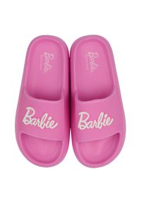 Badmode deze zomer: meer wit en minder bloot Badmode deze zomer: meer wit en minder bloot