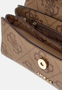 Brown patterned wallet featuring textured fabric, gold-tone hardware, a snap closure, and multiple compartments for organization.