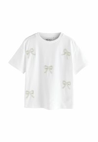 Hvid bomulds T-shirt med flere broderede lysegrå sløjfer. Korte ærmer, rund halsudskæring, afslappet pasform.