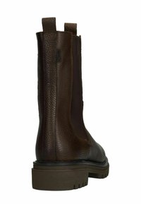 Brown leather ankle boot with textured finish, elastic side panels, and a chunky brown sole, featuring pull tabs for easy wear.
