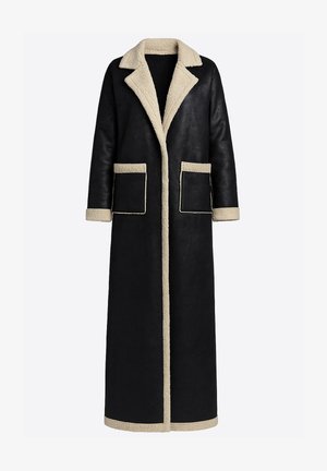 Lang sort læderfrakke med beige skindkrave, manchetter og lommekanter. Har åben front og to store forlommer.