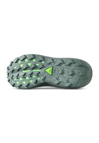 Gray rubber outsole with thick treads and green accents, featuring multi-directional lugs for traction and a distinct triangular pattern.