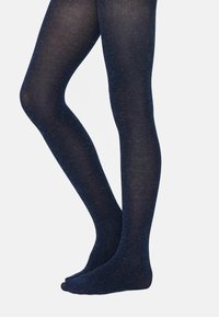 Collant blu navy con una texture liscia e una leggera luminosità. Progettati senza una vita visibile, presentano uno stile con piede.