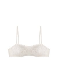 Krajkový bralet v off-white barvě s tenkými ramínky, vlnitými okraji a květinovým vzorem, s hladkým povrchem a tvarovanými košíčky.