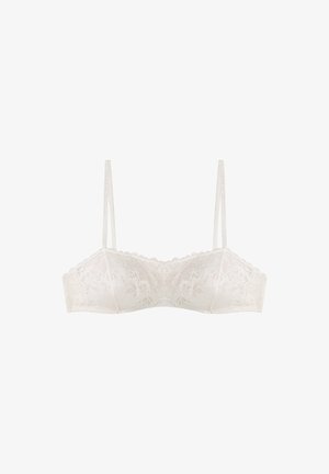 Kant bralette in off-white met dunne bandjes, golvende randen en bloemmotieven, met een gladde afwerking en gestructureerde cups.
