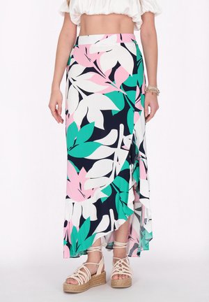 Maxi nederdel med blomsterprint, der har en marineblå baggrund, pink og grønne bladedesigns, asymmetrisk kant og let stof.